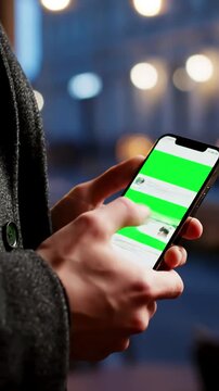 Green Screen 4k man using iphone 12 smartphone viewing on phone press browsing chroma key online typing text reading social media close up hands 24 04 21 st petersburg russia scene 1 with distortion