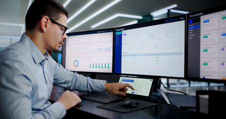 Busy Office Worker Using Desktop Computer