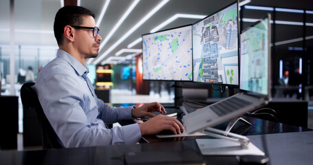 Young Hispanic Man Using CAD Software