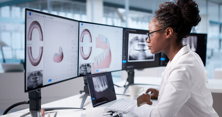 Black Female Dentist Uses Computer
