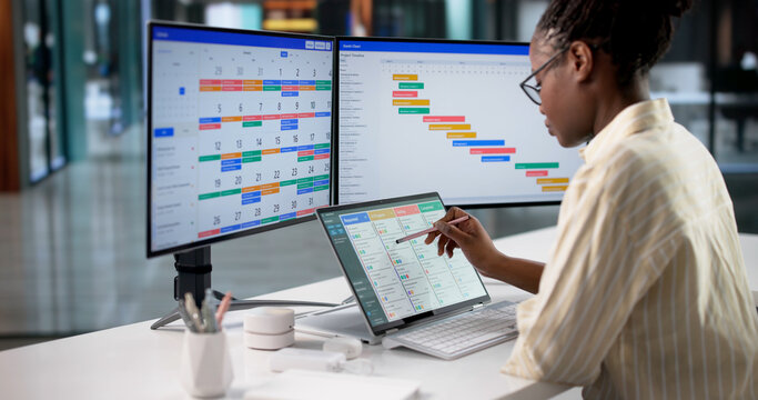 Female Business Manager Organizing Tasks On Laptop