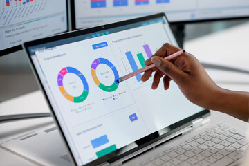Woman Analyzing Data On Computer Dashboard