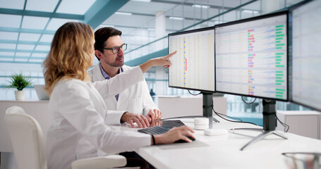 Medical Professionals Reviewing Bill Codes