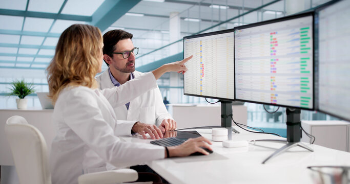 Medical Professionals Reviewing Bill Codes