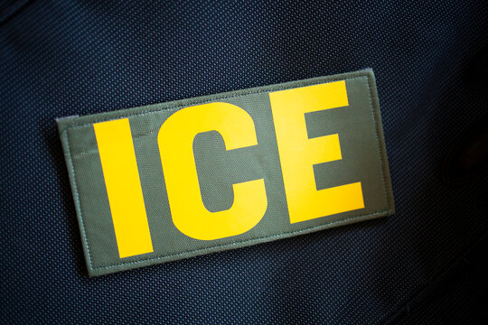Detail of an ICE patch on a black background.