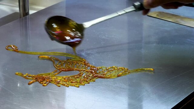  Chinese traditional intangible cultural heritage handmade sugar painting, featuring a phoenix pattern