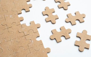 Fototapeta premium Wood Puzzle Pieces on white Background Representing Problem Solving