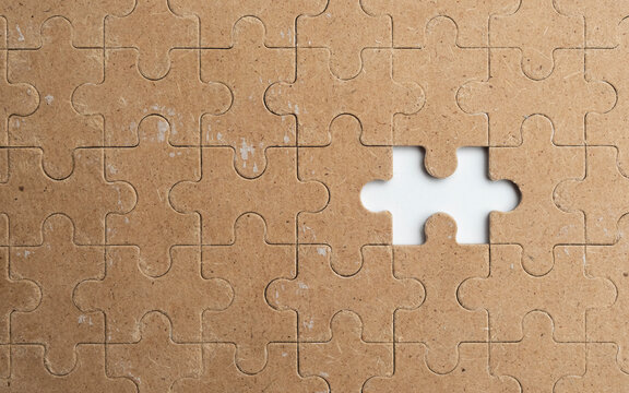 Empty wooden puzzle on a clean white background with copy space, suitable for advertising concepts, branding, marketing messages, and creative design.