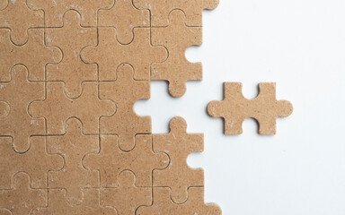 Fototapeta premium Wood Puzzle Pieces on white Background Representing Problem Solving