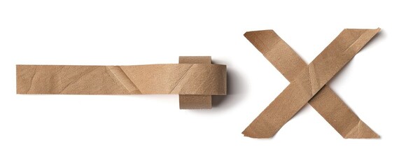 Cardboard strips forming X, flat lay, background. For environmental messages