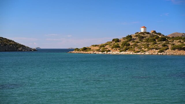 Windmill on a Hill Above the Sea Near Panormitis Monastery on Symi Island, Greece