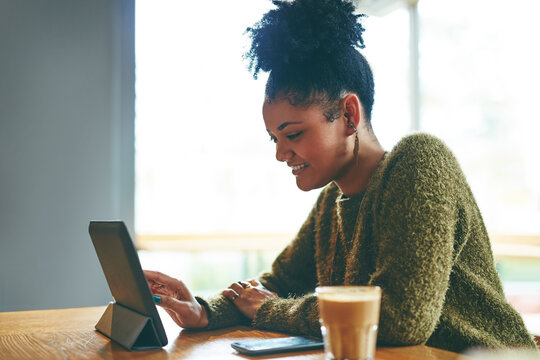 University student, girl and happy with tablet in cafe for online learning, exam revision and study. Education, african person and smile with tech in restaurant for thesis research and college portal