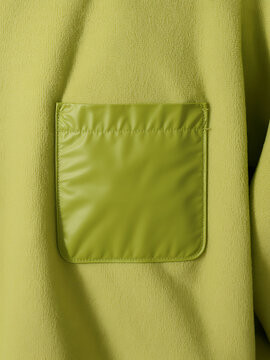 Close-up of a Bright Lime Green Fleece Jacket Pocket with Contrasting Shiny Trim and Stitching