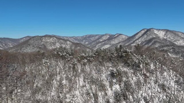 Drone footage, Winter landscape, river, mountain, village in Gapyeong city, South Korea