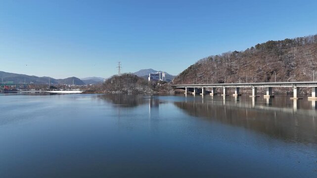 Drone footage, Winter landscape, river, mountain, village in Gapyeon city, South Korea