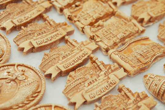 A bunch of souvenirs of Mardin in Turkey with the symbols of this historical city on them. Shahmaran Legendary creature (or Shah Maran - half woman and half snake)