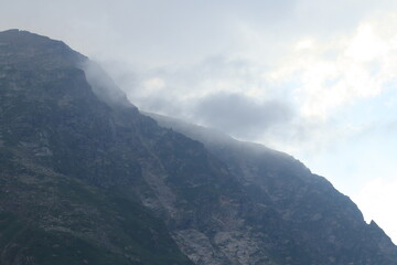 Fototapeta premium The North Caucasus Mountains in clouds and fog on a summer day