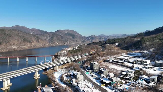 Drone footage, Winter landscape, river, mountain, village in Gapyeon city, South Korea