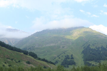 Fototapeta premium Clouds in the North Caucasus Mountains on a summer day