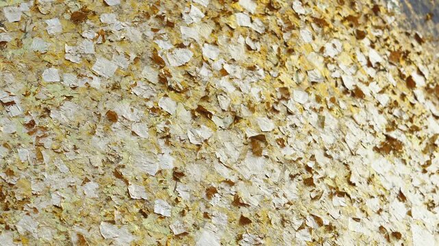texture of gold leaf wall,golden background on buddha image or temple wall