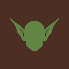Illustration of a goblin or elf face with pointed ears and green skin.