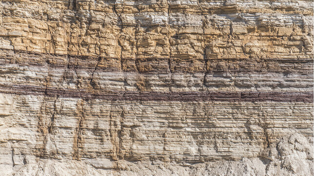bedrock. Geological rock layers exposed in a quarry wall, textured stone patterns in earth tones. event key visuals, club posters, designed for fitness apps and gym onboarding.

