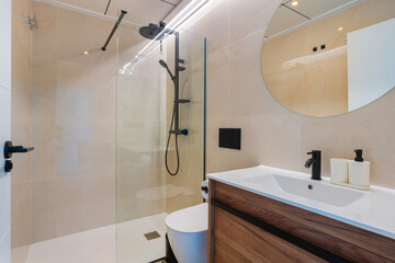 Contemporary bathroom with glass walk-in shower, wood vanity and matte black fixtures