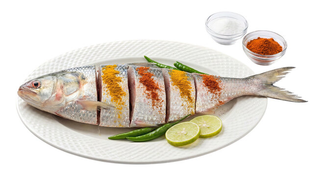 Raw Sliced Fish Marinated with Spices Turmeric and Chili on White Plate