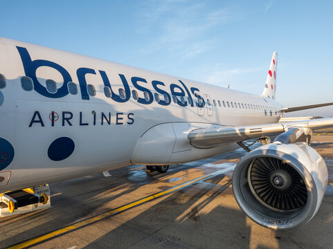 26 december, Brussels, Belgium. Close up, close view, side, and engine of a commercial airplane standing at the airport terminal. Airplane from SN Brussels airlines. Aviation, travel theme.