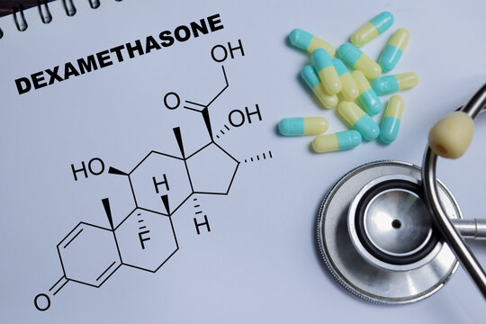 Concept of dexamethasone corticosteroid drug write on book isolated on Wooden Table. for Anti-inflammatory and immunosuppressive therapy