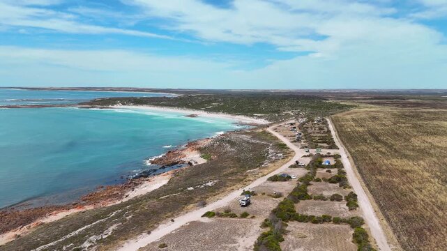 Daly Head coastline with ocean road, cliffs, and rugged South Australian shoreline, camping plots overlooking clear blue water