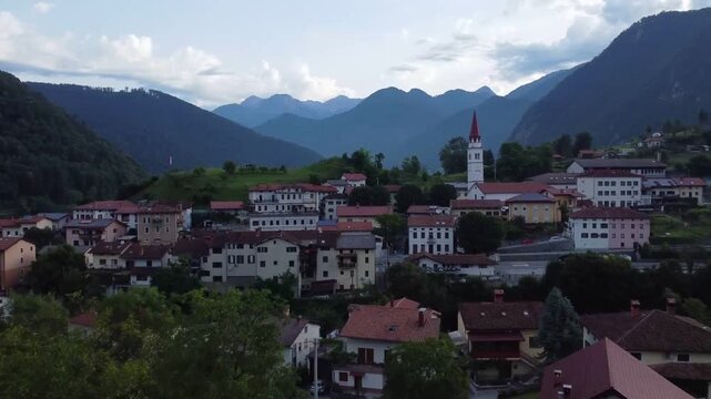 Wide shot of Most na Soci village in Soca Valley Slovenia at dusk.