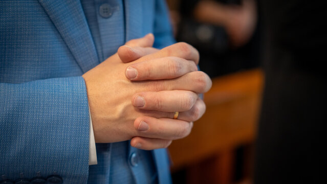 Closeup photo of hands folded together in prayer