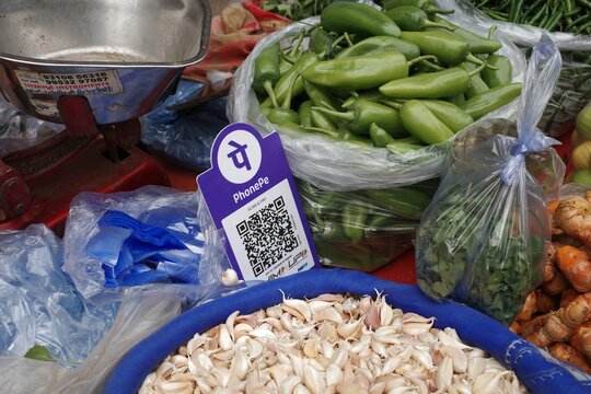 shop accepting digital UPI QR code payment, cashless payments in india. New Delhi 2026