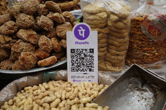 shop accepting digital UPI QR code payment, cashless payments in india. New Delhi 2026