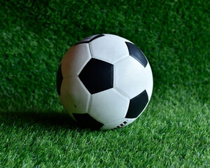 Fototapeta premium A classic black and white soccer ball. Made of PU or PVC. Featuring an iconic hexagonal and pentagonal panel design. Suitable for soccer matches or training.