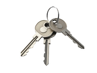 A collection of keys piled up on top of each other, possibly in a locker or a storage container
