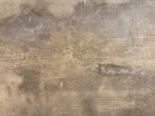 Close up of concrete washed cement texture with random dark grunge, and dirt pattern. Suitable for wall and floor finishes. Seamless background texture.