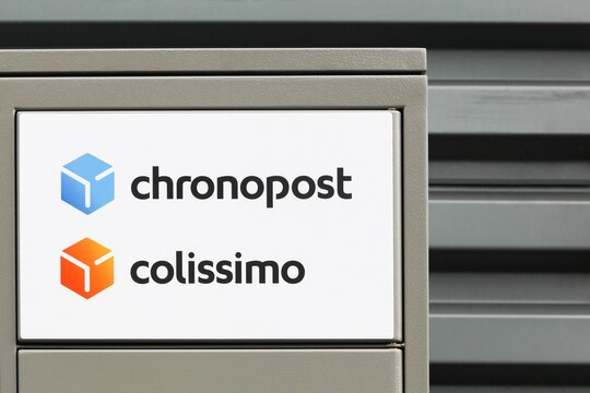 Montceaux, France - September 29, 2024: Chronopost and colissimo logo on a wall. Chronopost is a member of the La Poste group, provides express shipping and delivery service in France
