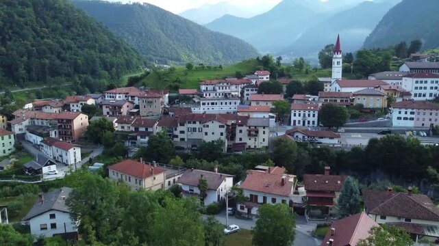Wide shot of Most na Soci village in Soca Valley Slovenia during evening twilight.