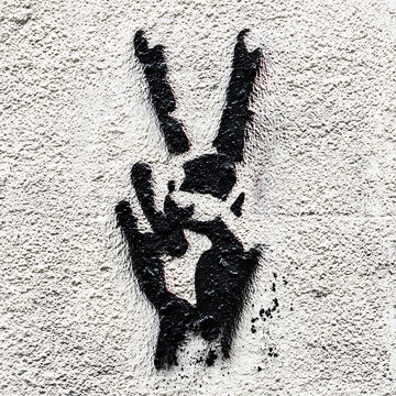 Peace sign graffiti on textured wall high resolution photo