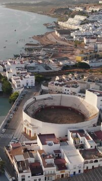 Vertical aerial view showcasing the Moorish-style Plaza de Toros bullring in Ayamonte, Huelva, southern Spain.