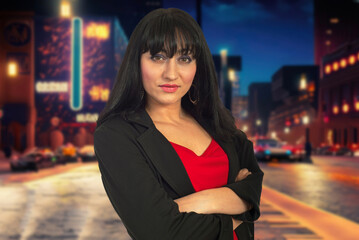 A woman in a purple suit is standing on a city street