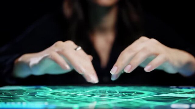 Extreme close-up video of adult human fingertips performing precise pinch-to-zoom and drag gestures on a glowing, futuristic digital map interface, sleek modern aesthetic