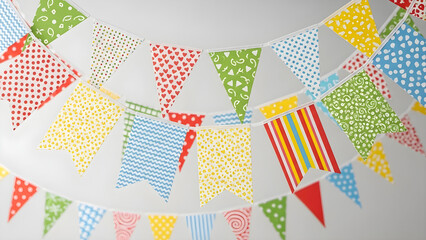 Colorful triangular bunting flags with various patterns hanging in celebration of Eid festivities with vibrant decorations