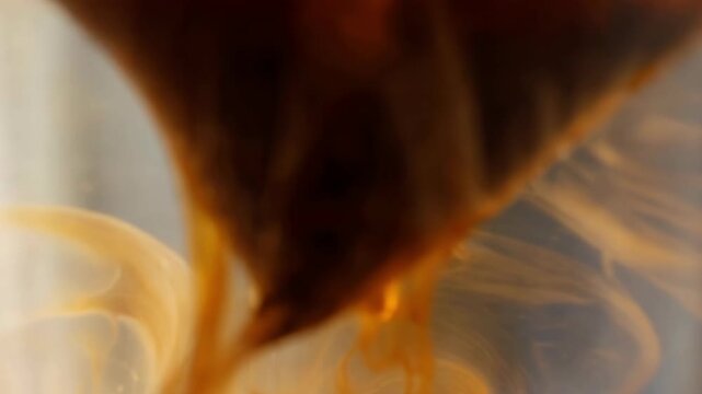 Tea bag dipping into hot water slow motion beverage commercial close up liquid infusion refreshment advertisement background copy space morning