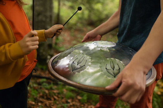 Teaching the handpan among the trees. Relationship between teacher, student, and nature.