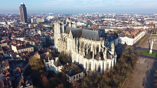 Drone arcs around Nantes Cathedral with Place Mar&eacute;chal Foch and landmarks nearby