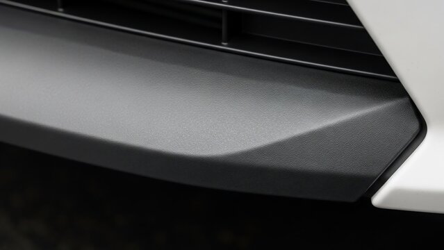 Close-up of a modern car's front bumper and grille.