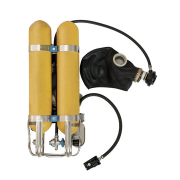 Early self-contained breathing apparatus with twin yellow air tanks, mounted on a metal frame, black rubber mask, regulator and hoses,used in firefighting and rescue operations, on a white background
